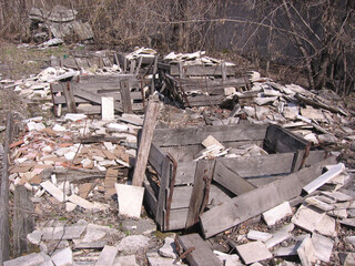 old broken wooden crates were thrown into the garbage dump
