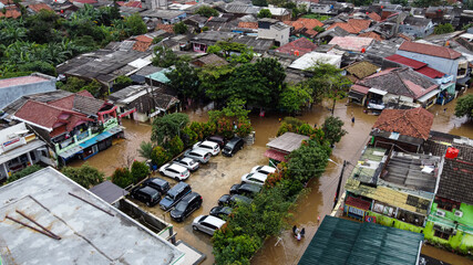 Fototapeta premium Aerial POV view Depiction of flooding. devastation wrought after massive natural disasters. BEKASI, WEST JAVA, INDONESIA. FEBRUARY 23, 2021