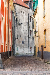 Fototapeta na wymiar Baltic States, Estonia, Tallinn. Tallinn Old Town's cobblestoned narrow street.