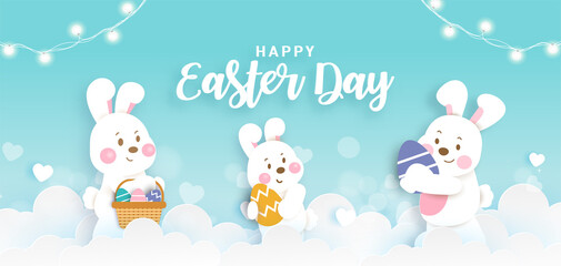 Easter day banner with  cute rabbiits and easter eggs in paper cut style.
