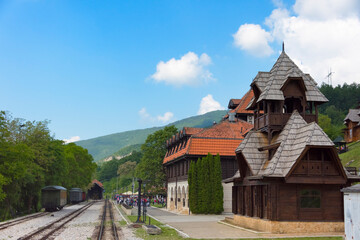 Fototapeta na wymiar Wood cabin structure at Sargan Eight train station, a narrow-gauge heritage railway, Mokra Gora, Serbia