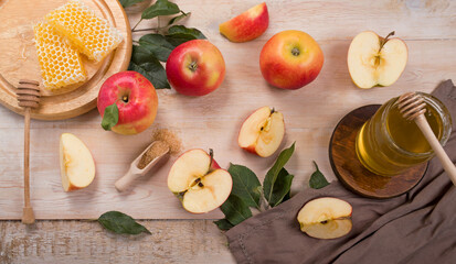 Jewish holiday Rosh Hashana background with apples and honey on blackboard. View from above. Flat lay