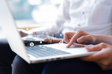 close up businesswoman hand scrolling on laptop to check or read news about stock market and cryptocurrency exchange with businessman to consult and advise together for business and technology concept