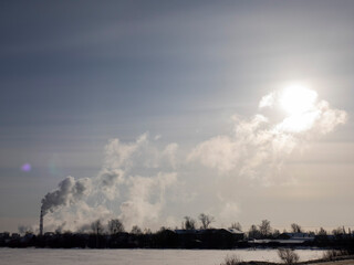 Smoke from the factory chimney. The concept of environmental protection