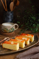 slice of Dutch style butter cake named boterkoek served in a plate  