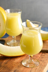 Glasses with melon smoothie on table