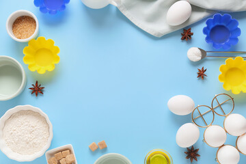 Frame made of kitchen utensils and ingredients for preparing bakery on color background