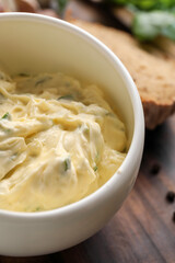 Bowl with tasty garlic butter, closeup