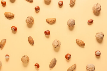 Different healthy nuts on color background