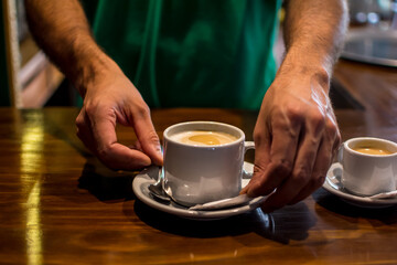 man holding cup of coffee
