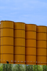 Yellow Construction Silos. Vertical shot 