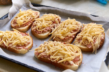 homemade open faced hot sandwiches with sausage and cheese