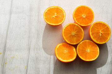 Fresh ripe oranges on white stone background/ Top view with copy space/ detox diet concept