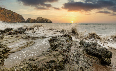 Rock formations against the backdrop of the ocean in the San Francisco Recreation Area, Rodeo Beach, California, USA. Seaside, beautiful landscape, California coast.