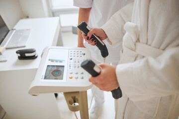 Doctor checking his patient health on a modern equipment