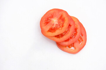 the red tomato sliced isolated on white background.