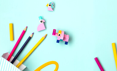 Children art concept colorful flat lay.Work kids desk with craft supplies top view. Children education themed photo.