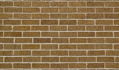 Brown brick surrounding wall section, color swatch sample. Plain earth tones full frame image.