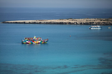 Ship - rainbow in the Bay of the Mediterranean sea, the island of Cyprus