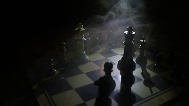 chess board game for ideas and competition and strategy, business success concept. Chess figures on dark. Selective focus