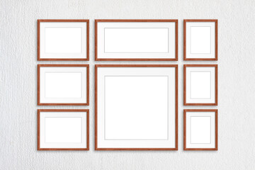 Photo frames collage, eight realistic frameworks on white plastered wall, interior decor mock up