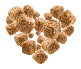 Brown cane sugar in the shape of a heart on a white background