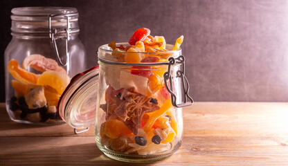 Assortment of sweet dried fruit. Assortment of sweet colorful dried fruit on a dark colored table.
