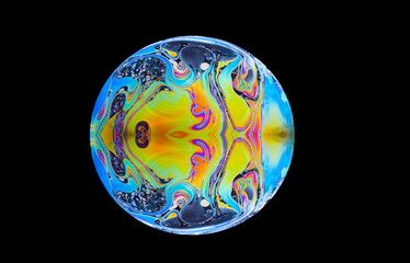 close up of a soap bubble. Close up of a abstract, soap bubble resembling a planet. Copy space on a...