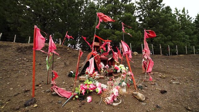 A wayside shrine to Gauchito Gil in Argentina, static medium shot