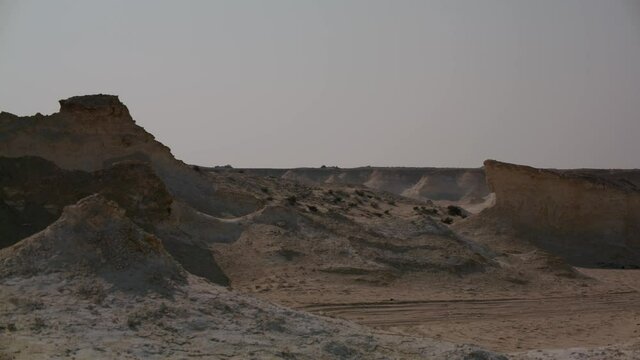 Camera sliding from left to right showing the rocky area in Zekreet Desert in Qatar 2.