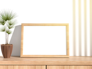 A framed canvas on the table, next to a vase with a plant. Bright beams of light illuminate the wall. 3D Render.