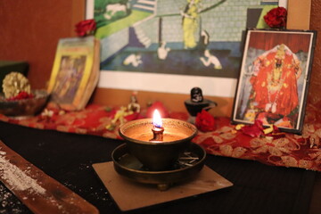 Naklejka na ściany i meble A small Hindu shrine and a lamp in the house
