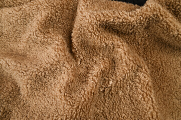 Fototapeta na wymiar Crumpled brown fabric, close up