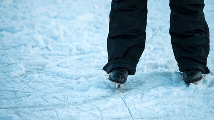 Close-up of legs in ice-skates