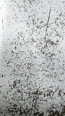 An old destroyed wall with cracks and scratches. Abstract grunge background texture for design posters, advertising and more.