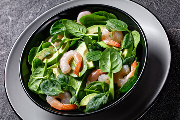 Salad of shrimps, spinach, and sunflower sprouts