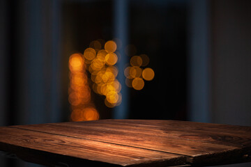 empty table to showcase your product, against the background of a blurred cafe golden bokeh