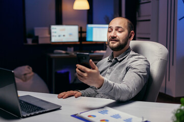 Freelancer in empty office talking on online call with someone. Businessman in the course of an...