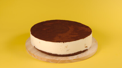 Сhocolate cake on a yellow background