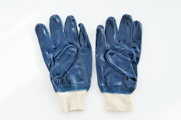 Blue latex gloves on a white background.