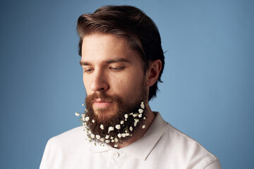 Cute man and white T-shirt flowers on beard decoration