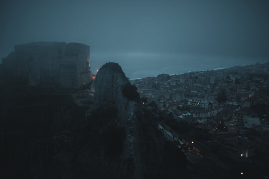 Castle of Roccella Jonica in the middle of the fog. Calabria, Italy