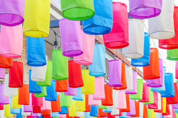 colorful lanterns hanging on the rope. lantern festival decorated in Thailand.