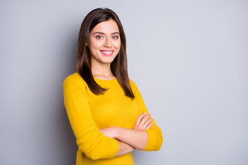 Photo of young happy cheerful positive attractive girl with crossed hands look camera isolated on...