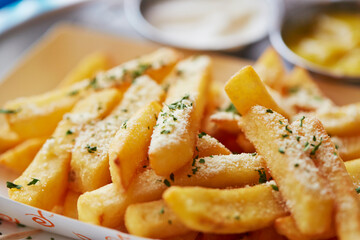 Cheese powder on top of French fries
