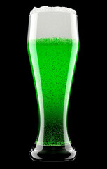 Frosty glass of draft green beer with bubble froth isolated on black background.