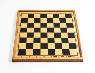 Chess board photographed on a white background.
