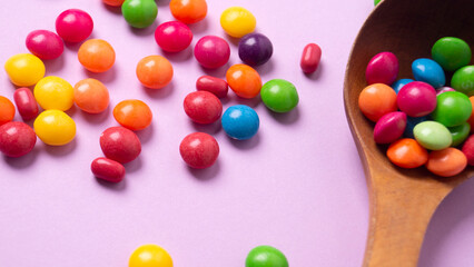 multicolored candy set with a wooden spoon