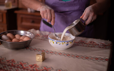 housewife preparing yeast in the kitchen. growth ingredient for cakes