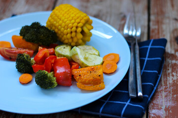 Oven roasted colorful vegetables are waiting for you in the cyan plate, let's try it! Bon appetit
